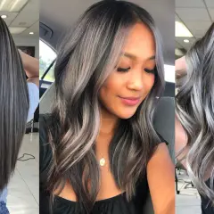 Cabello oscuro con mechas plateadas y grises, un estilo moderno para disimular canas.