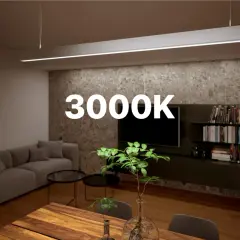 Nowoczesny salon z sofą, stołem i półkami. Ciepłe światło LED 3000K tworzy przytulną atmosferę.