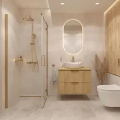 Nowoczesna łazienka z prysznicem, wiszącą szafką i toaletą. Złote baterie i detale nadają elegancji. Idealne miejsce, by pomyśleć, jakie IP do łazienki będzie najlepsze.