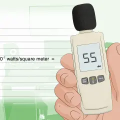 Medidor de sonido muestra 55 dB, un nivel de ruido moderado. La fórmula indica 3 x 10⁻⁷ watts/m², un ejemplo de 60 dB.