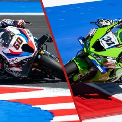 Dos motos de **BMW MotoGP** compiten en una carrera, una blanca y roja con el número 60, la otra verde con el número 31.