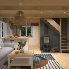 Przytulne wnętrze małego domku letniskowego: szara sofa, drewniane belki, kuchnia, piecyk i schody. Inspiracja, jak urządzić mały domek letniskowy.