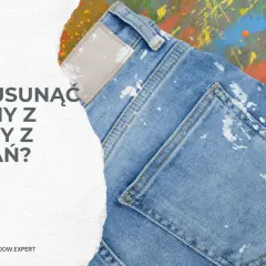 Dżinsy z plamami farby na tle kolorowych rozbryzgów farby.