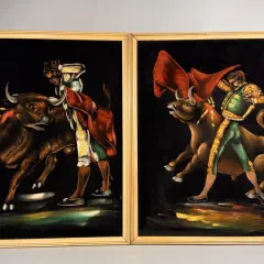 Two paintings by 1970s artists painters depict matadors facing bulls. The vibrant velvet art captures the drama of the bullfight.