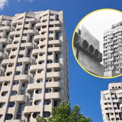 Wrocławski Manhattan: charakterystyczne bloki z lat 70. z falującymi balkonami i okrągłymi oknami, na tle błękitnego nieba.
