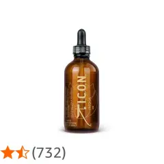 Frasco ámbar con gotero de ICON India Oil, un aceite exótico para el cabello.