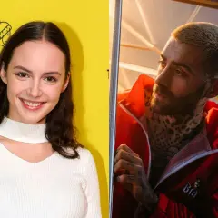 Martyna Byczkowska uśmiecha się na tle żółtej ściany, obok Quebo w czerwonej kurtce z tatuażami.