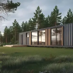 Modernt container hus vid en sjö, omgivet av tallskog och gräs. Solnedgången speglas i de stora fönstren.