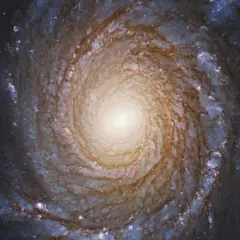 Wirująca galaktyka spiralna, której centrum przypomina wirujący dysk, jakby słychać było dźwięk czarnej dziury.