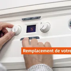 Main tenant un bouton de réglage sur une chaudière. Un guide complet sur le changement de chaudière fioul.
