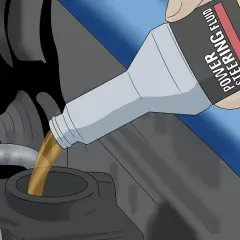 Persona vierte aceite de dirección asistida en el depósito del motor.