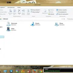 Gdzie jest panel sterowania w laptopie? Widok folderu "Biblioteki" z ikonami Dokumenty, Muzyka, Obrazy i Wideo.