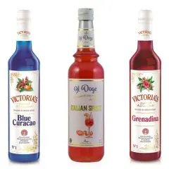 Pięć butelek syropów barmańskich: Triple Sec, Blue Curacao, Italian Spritz, Grenadina i Cane Sugar. Idealne soki do drinków.