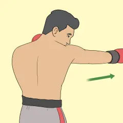 A boxer demonstrates how to roll their shoulders to evade a punch, with a green arrow indicating the direction of movement.