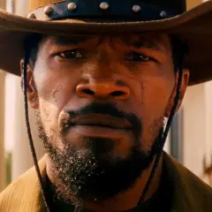 Jamie Foxx in Django Unchained, un volto che promette vendetta. Le recensioni del film lo celebrano.