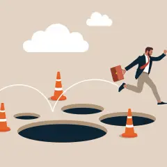Un homme d'affaires saute par-dessus des trous, symbolisant les dangers du processus d'achat immobilier.