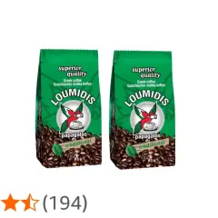 Zwei Packungen Loumidis Kaffee mit Papageien-Logo und Kaffeebohnen. "Superior quality" und "traditional" sind auf den Packungen zu sehen.