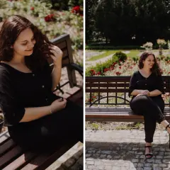 Uśmiechnięta kobieta plus size na sesji kobiecej w parku, siedzi na ławce wśród czerwonych róż.