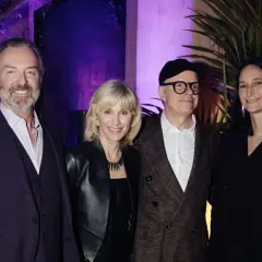 Four individuals pose at an event for the Serpentine Americas Foundation.