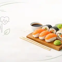 Zestaw sushi na desce, sos sojowy, wasabi. Czy sushi jest kaloryczne? Zależy od składników, ale często jest to zdrowa opcja.
