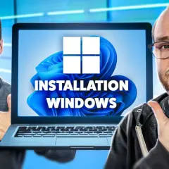 Deux hommes font un pouce levé devant un écran d'ordinateur affichant "INSTALLATION WINDOWS" et le logo Windows 11.