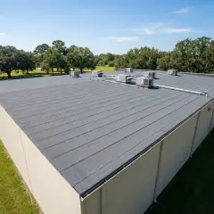 A commercial building with a durable SBS roofing system, featuring multiple HVAC units on its flat, grey surface.