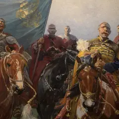 Józef Brandt obrazy: husaria na koniach, z chorągwią i w zbrojach, gotowa do walki. Dynamiczna scena historyczna.
