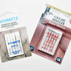 Two packages of sewing machine needles for knits: Schmetz Stretch and Organ Super Stretch.