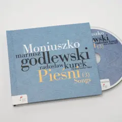 Płyta CD z nagraniem "Pieśni" Moniuszki w wykonaniu Mariusza Godlewskiego i Radosława Kurka. Prząśniczka tekst na okładce.