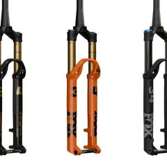 Three Fox Float SL suspension forks: one black with gold accents, one bright orange, and one matte black. Ready to float over any terrain.