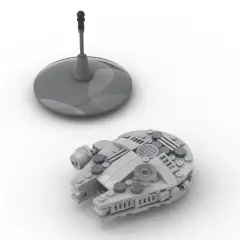 Grauer Lego Millennium Falcon auf weißem Grund, daneben ein Display-Ständer. Die Lego Millennium Falcon Anleitung ist hier zu sehen.
