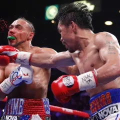 Manny Pacquiao lands a powerful punch, showcasing effective boxing counters as blood sprays from his opponent's mouth.