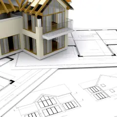 Model domu na planach architektonicznych. Zastanawiasz się, ile trwa budowa domu? To zależy od wielu czynników, ale projekt to pierwszy krok.