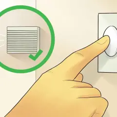 Dedo presionando un timbre. Un círculo verde con un check indica que el timbre funciona, útil para saber como arreglar el timbre de la puerta.