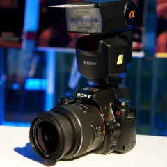 A Sony a37 camera with a flash unit attached, ready to capture any moment.