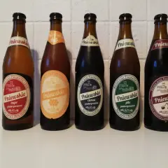 Pięć butelek piwa Pniewskie: jasne, pszeniczne, ciemne, pils i wiśniowe. Ciemne piwo to gatunek ciemnego piwa.