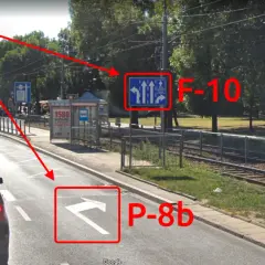 Droga z wyznaczonym buspasem. Znak F-10 informuje o pasach ruchu, a P-8b wskazuje kierunek jazdy.