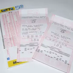 Kupony loterii promocyjnej Lotto. Widoczne numery i kody, szansa na wygraną.