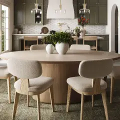 A large, light wood oval dining table with upholstered chairs, showcasing standard oval table sizes for a cozy kitchen.