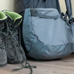 Hiking boots and backpack ready for adventure. Learn the best way to clean hiking boots to keep them in top condition for your next trek.