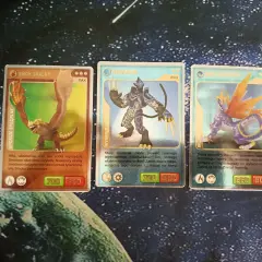 Karty Invizimals: Smok Skalny (700/950), Neko-Suke (750/900), Smok Gwiezdny (950/800).