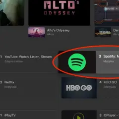 Ikona Spotify na liście aplikacji telewizyjnych, obok YouTube i Netflix.