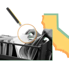 A hand sifts through files under a magnifying glass, symbolizing the open and transparent meaning of California's government.