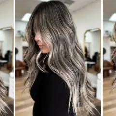 Pelo largo y ondulado con un degradado de color que combina canas y mechas rubias, creando un efecto moderno y natural.