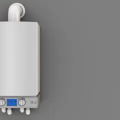 Nowoczesny piec gazowy z wyświetlaczem wskazującym temperaturę 49°C. Urządzenie pracuje w trybie eco, co sugeruje efektywne wykorzystanie energii i minimalizację kondensacji w piecu gazowym.