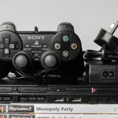 Konsola PlayStation 2 z kontrolerem i grami, idealna do uruchomienia jako ps2 emulator android.