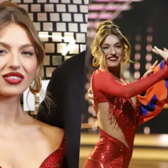 Izabela Skierska w czerwonej sukience tańczy z partnerem w stroju cyrkowym.