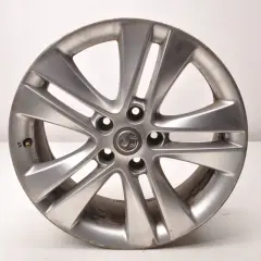 Srebrna felga aluminiowa do Opla Astry J. Rozstaw śrub 5x115.