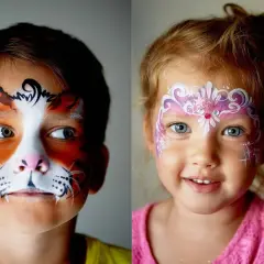 Zwei Kindergesichter mit fantasievollen Kinderschminken-Motiven: Ein Junge als Tiger, ein Mädchen als Prinzessin.