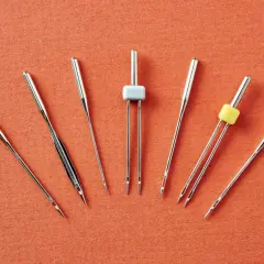 Sewing machine needles vary in size and design. Are all sewing machine needles the same? No, this image shows several different types.